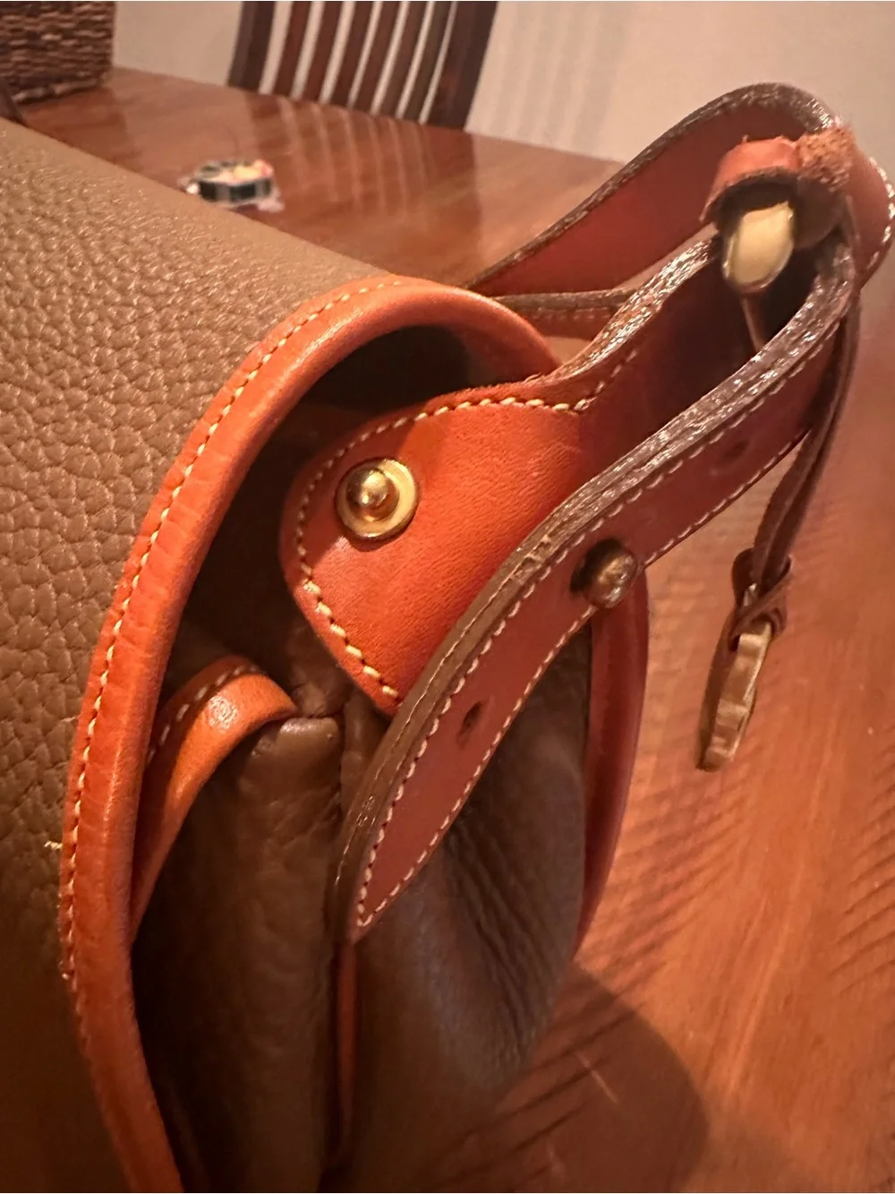 Dooney & Bourke Brown Pebbled Leather Horseshoe Crossbody with Tan Trim